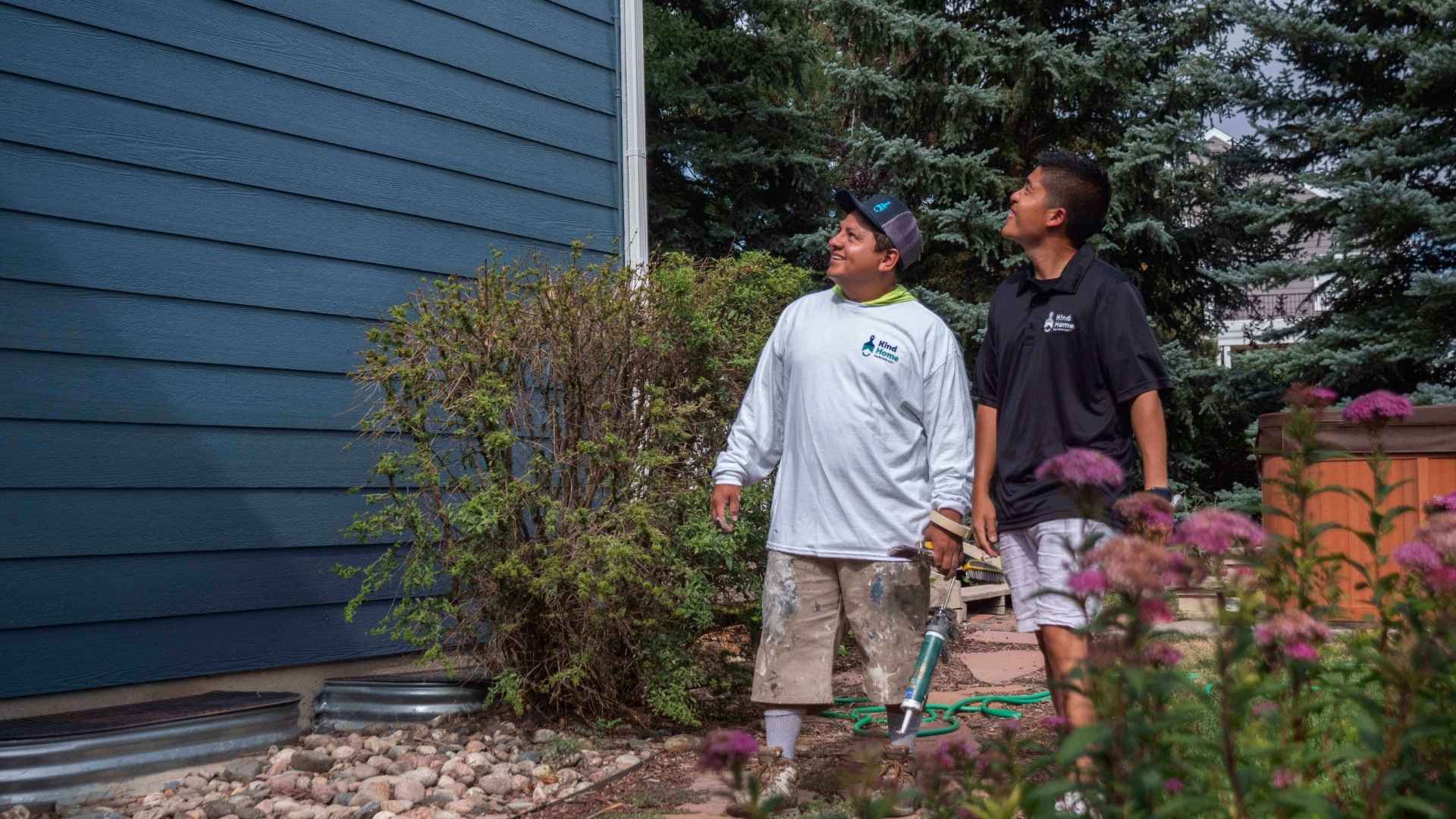 Kind Home painting painters walking an exterior painting project